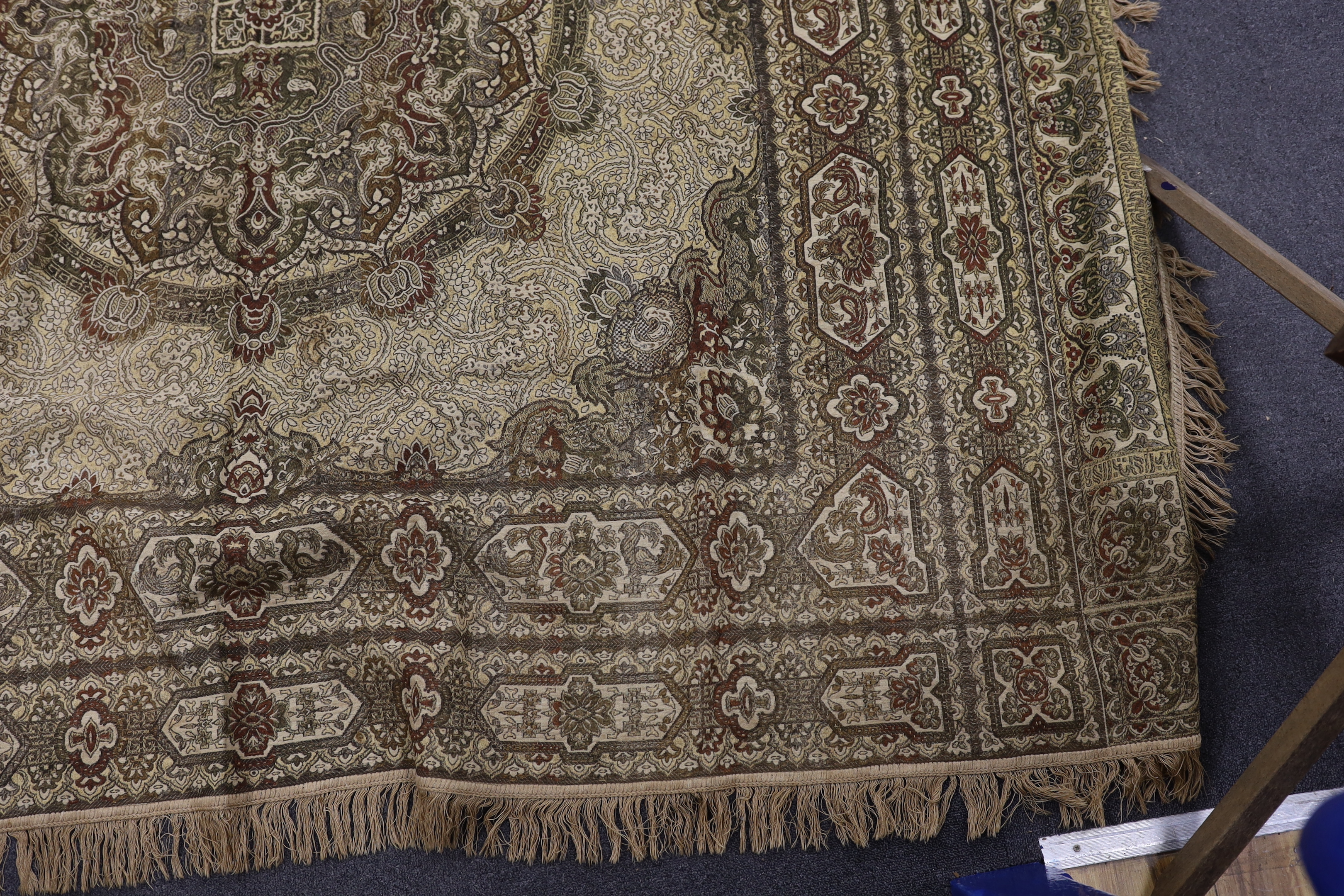 Two 19th century Indian heavy metallic thread embroideries on silk, another smaller similar panel and later 20th century machine woven fringed bedcover, two metal embroideries 53cm x 52cm